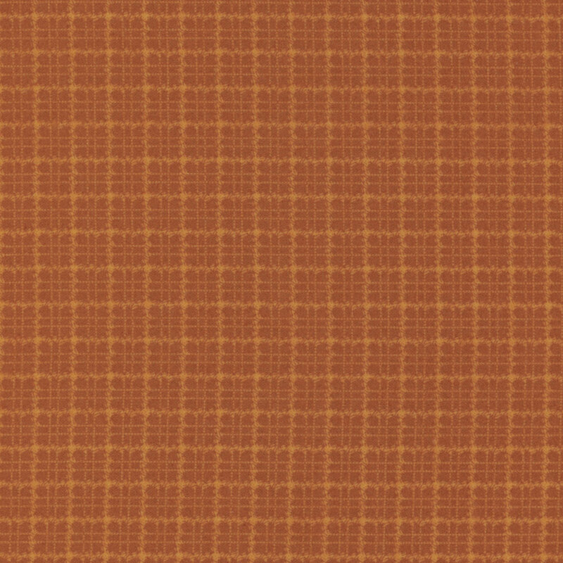 Burnt orange flannel fabric with a tonal plaid pattern