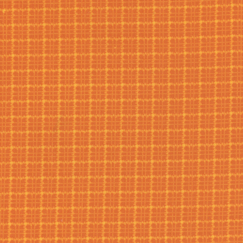 Orange flannel fabric with a tonal plaid pattern