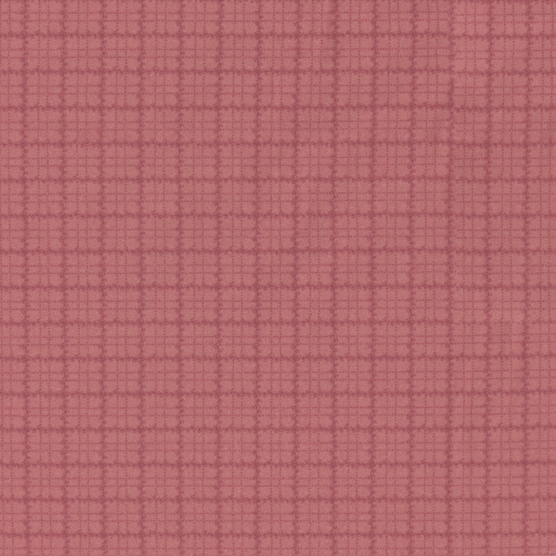 Berry red flannel fabric with a tonal plaid pattern