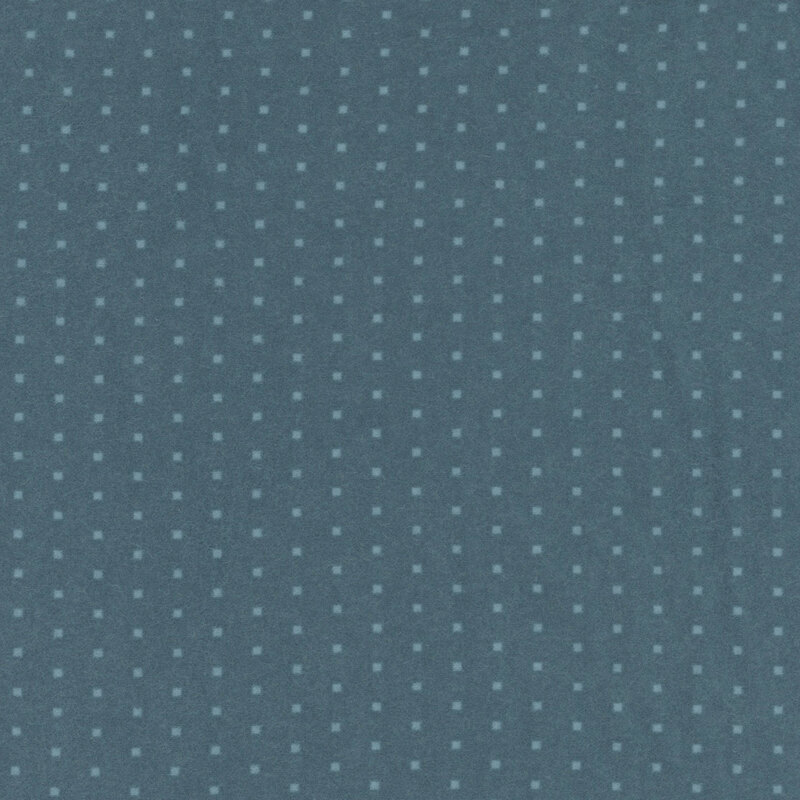 Blue flannel fabric with a tonal polka dot pattern 