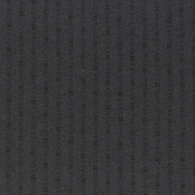 Black flannel fabric with a tonal textured stripe pattern 