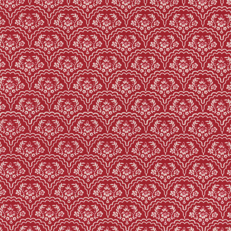 red fabric with white-outlined floral scallops