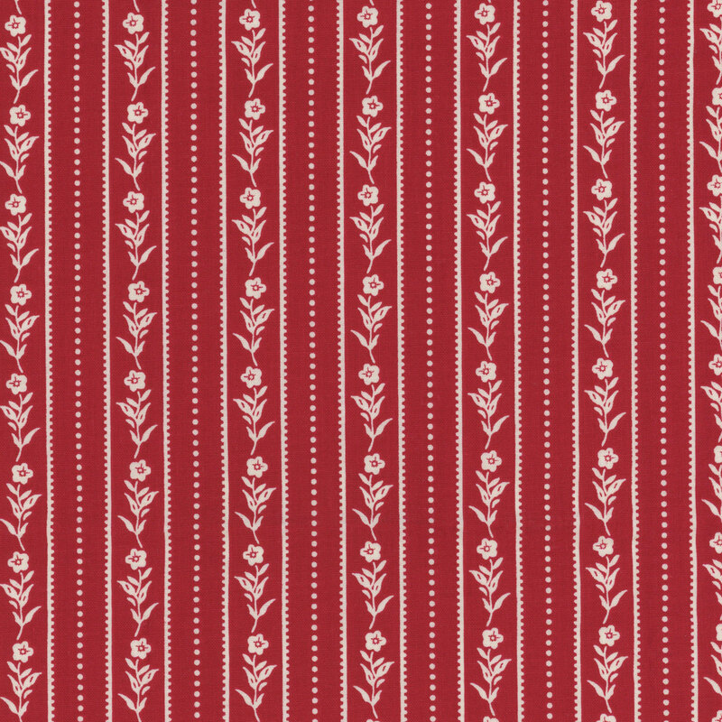 red fabric with white vertical lines of flowers, dotted lines, and stripes