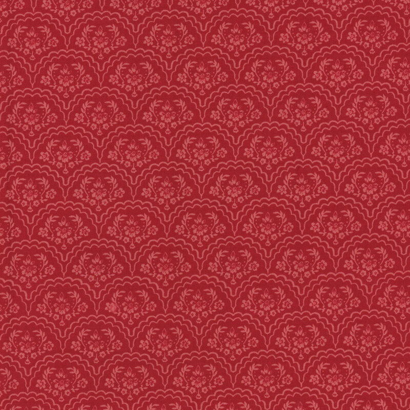 A repeating pattern of ornamental scallop shapes in shades of pink with floral designs on a red background.