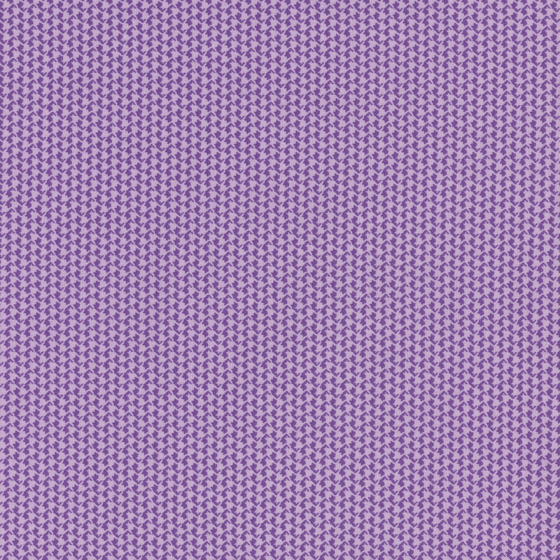 tonal purple fabric with alternating lines of houndstooth