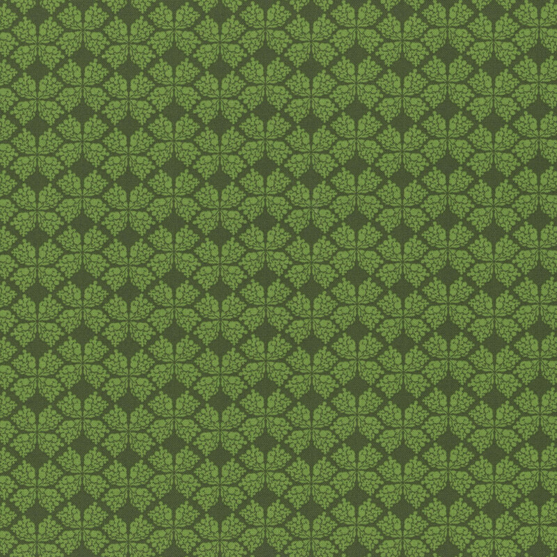 dark green fabric with a geometric clover-like pattern