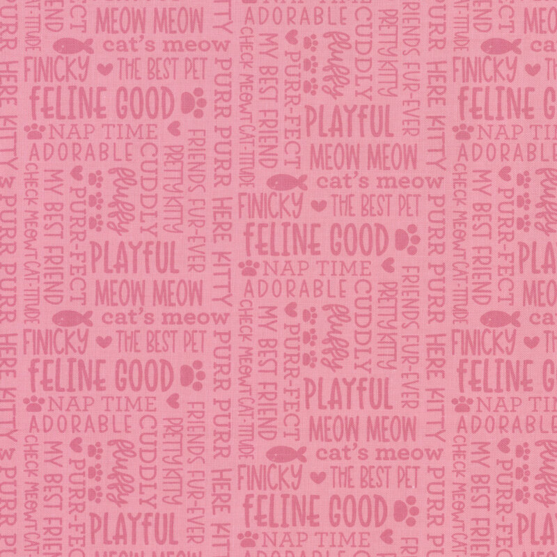 Pastel pink fabric with tonal words and cat themed phrases all over