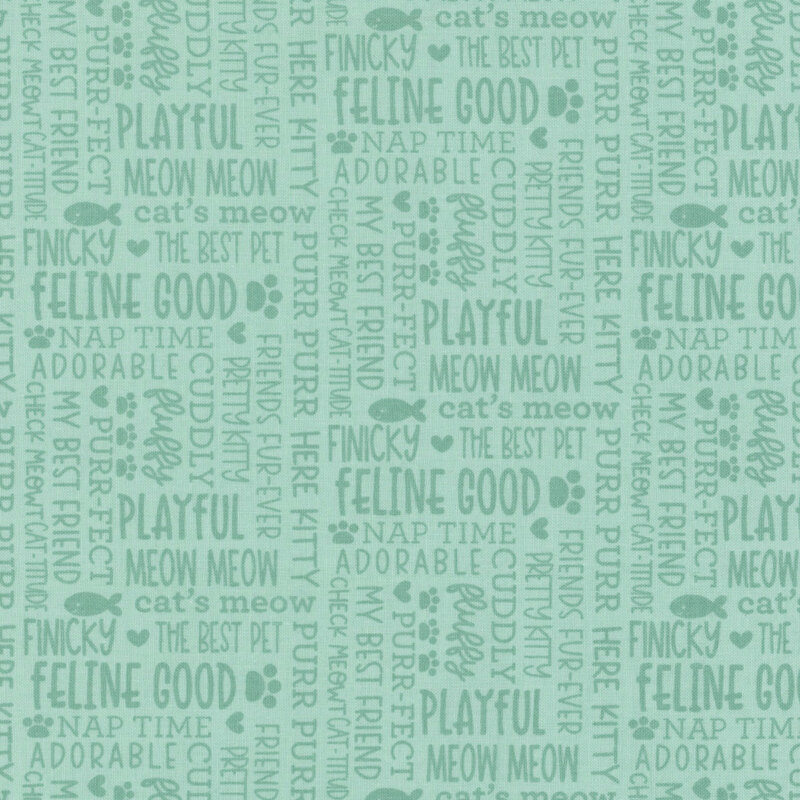 Pastel aqua fabric with tonal words and cat themed phrases all over