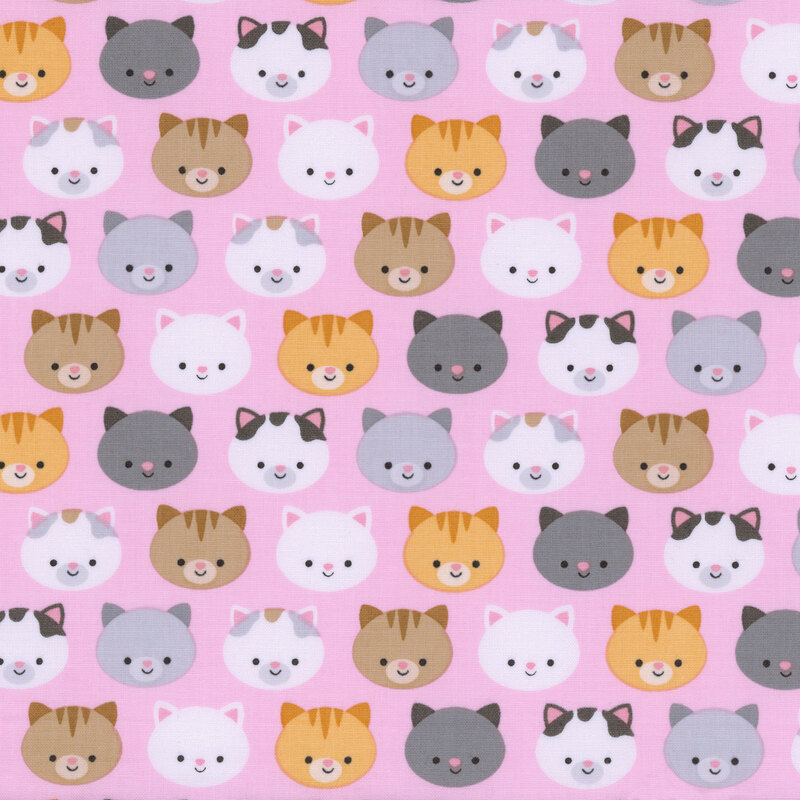 pink fabric with colorful orange, black, gray, and white cat faces all over