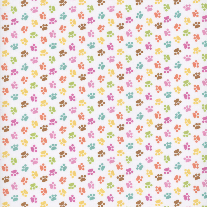 white sewing fabric with colorful ditsy cat paw prints throughout