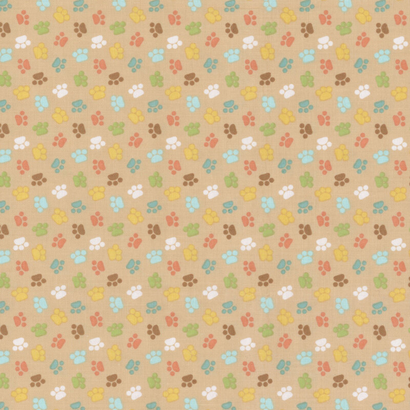 brown sewing fabric with colorful ditsy cat paw prints throughout