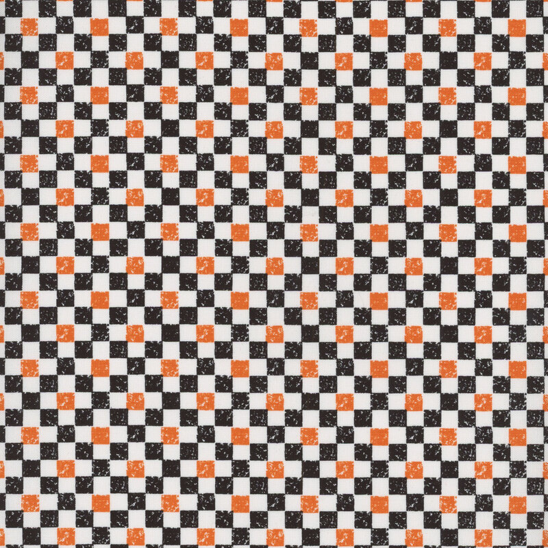 A Halloween black, orange, and white checker print fabric