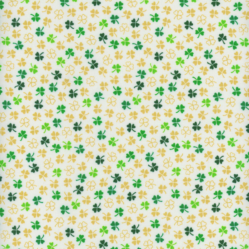 White fabric with small green and tan ditsy shamrocks throughout