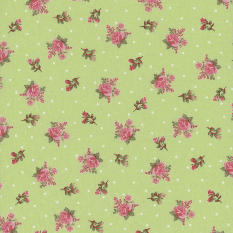 Pastel green fabric with white polka dots and a ditzy rose pattern