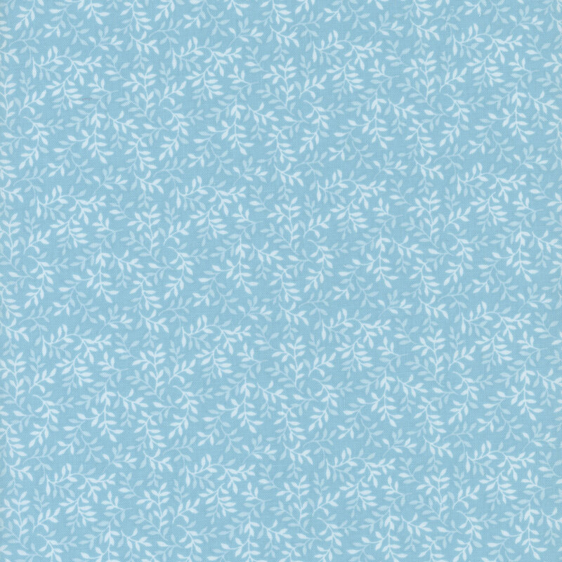 Light blue fabric with a tonal leaf pattern.