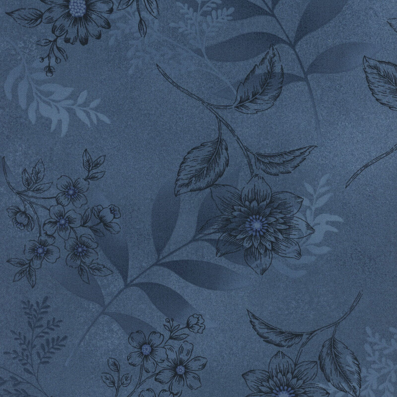 Mottled blue fabric with a tonal flower pattern 