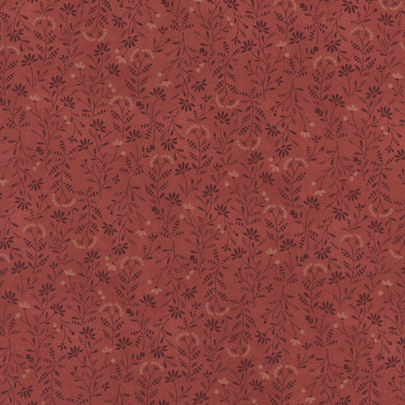 Red fabric with a tonal leaf and flower pattern 