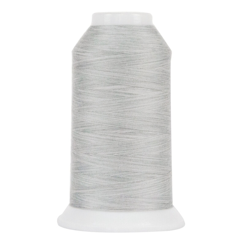 Spool of silvery gray thread, isolated on a white background.