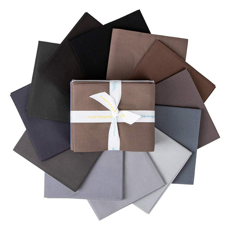The fat quarters included in the set, fanned out in an appealing circle, isolated on a white background.