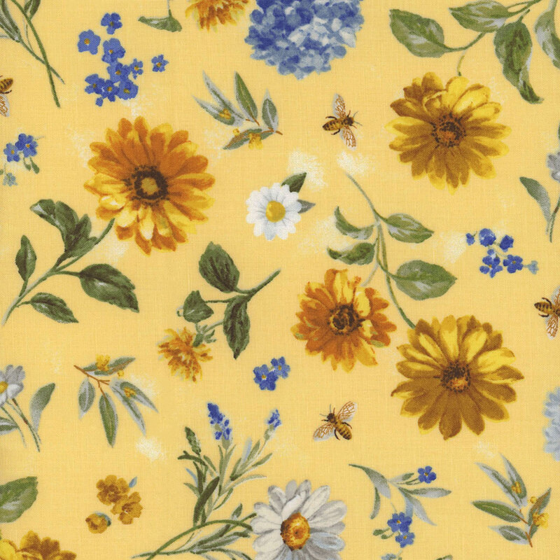 Pastel yellow fabric with yellow and white daisies, blue hydrangeas, and bees