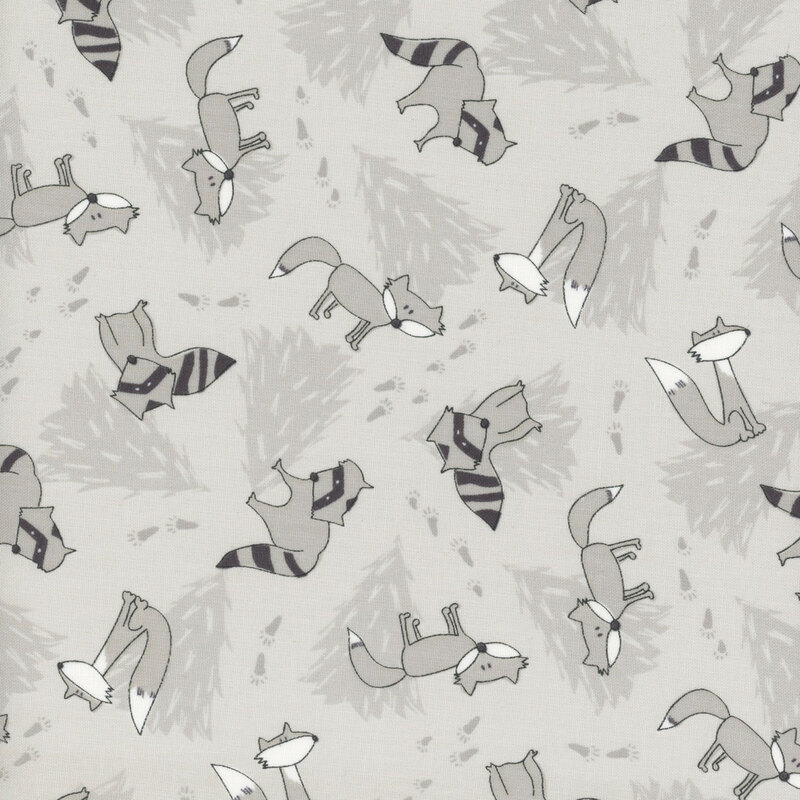 Gray fabric with tonal gray pine trees in the background and illustrated racoons and wolves tossed throughout