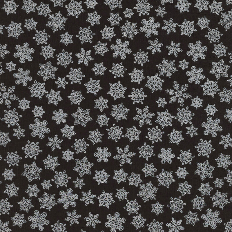 Black fabric featuring  silver snow flakes