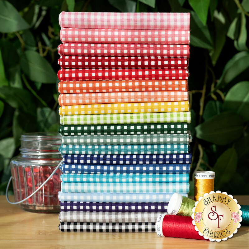 A stack of all the fabrics included in the Gingham 1/8