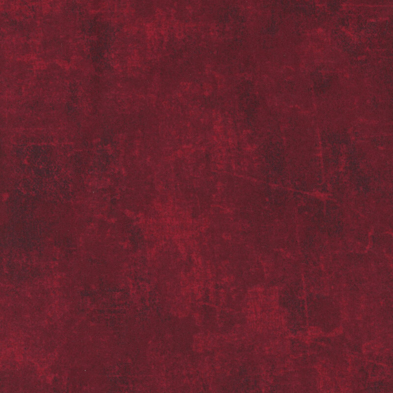 A swatch of wine red flannel fabric with a grunge texture.