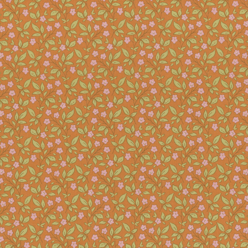 Orange fabric with a tossed pink floral and green leaf pattern.