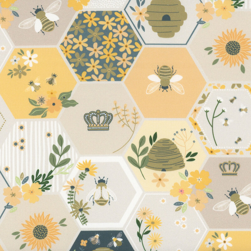 Multicolored fabric sorted in neutral, blue, and yellow honeycombs with scattered bee motifs.