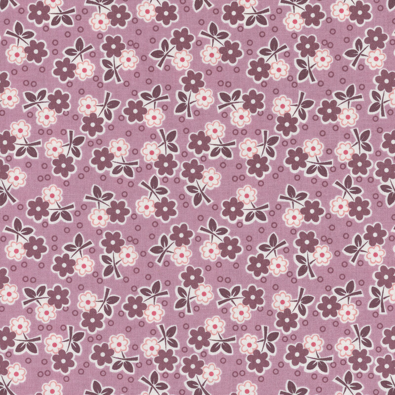 Plum fabric scattered with clusters of pink and purple flowers with circle dots.