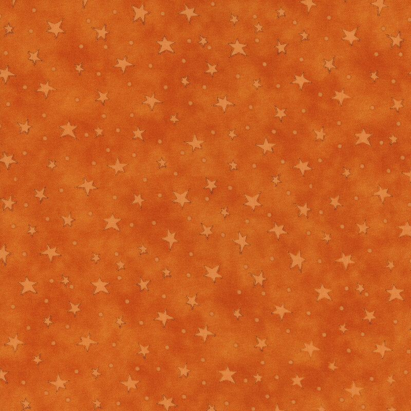 mottled orange fabric with scattered ditsy stars and tonal speckles