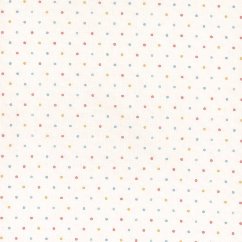 white fabric with pastel colored polka dots