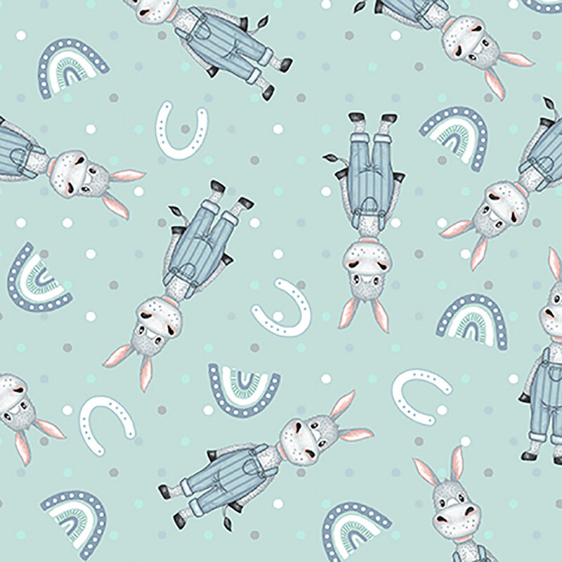 A patterned design featuring playful gray donkeys in blue overalls, interspersed with rainbows and horseshoes on a light blue background.