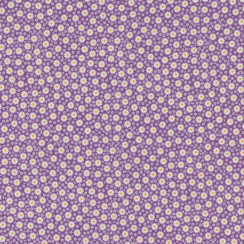 Purple fabric with simplified daisies on a background of small, thick circles.