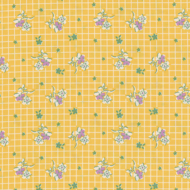 Yellow fabric with white, purple and green flowers in rows on a white gridded background.