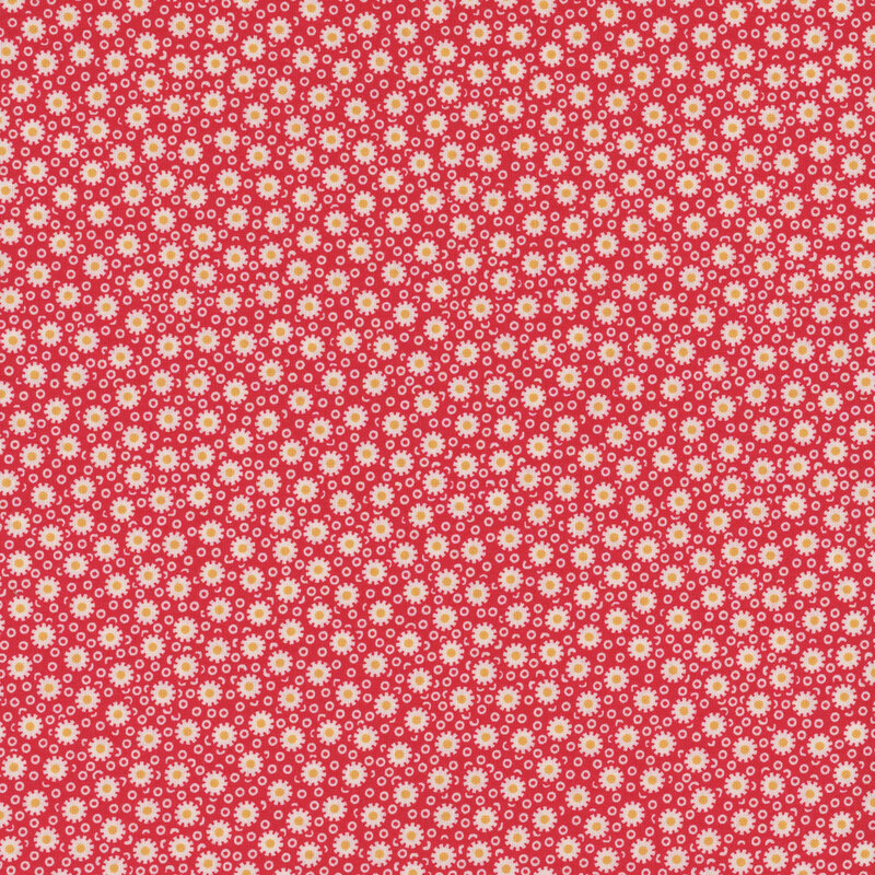 Red fabric with simplified daisies on a background of small, thick circles.