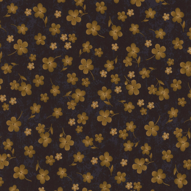 Black fabric with scattered golden flowers on a mottled background.