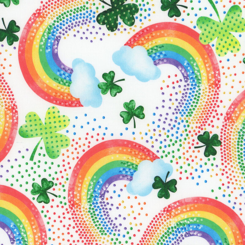 White fabric featuring rainbows, shamrocks, and colorful dots