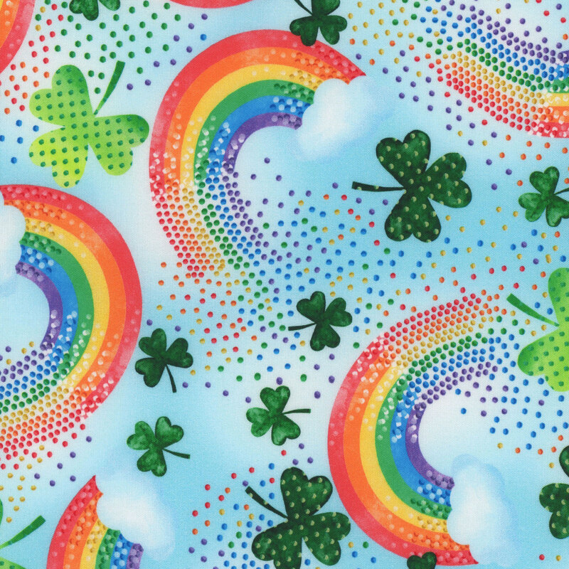 Blue fabric featuring rainbows, shamrocks, and colorful dots