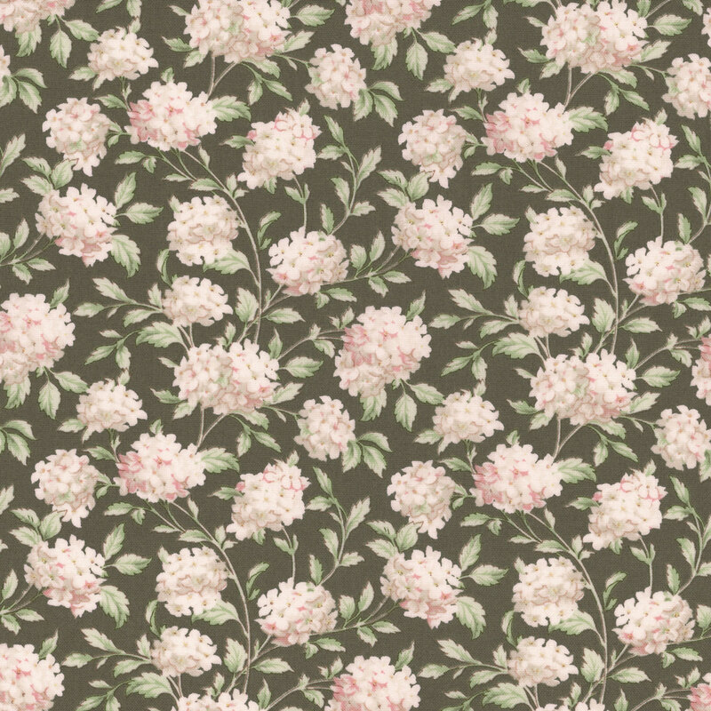 A swatch of green fabric with scattered bunches of pinkish white hydrangea flowers.