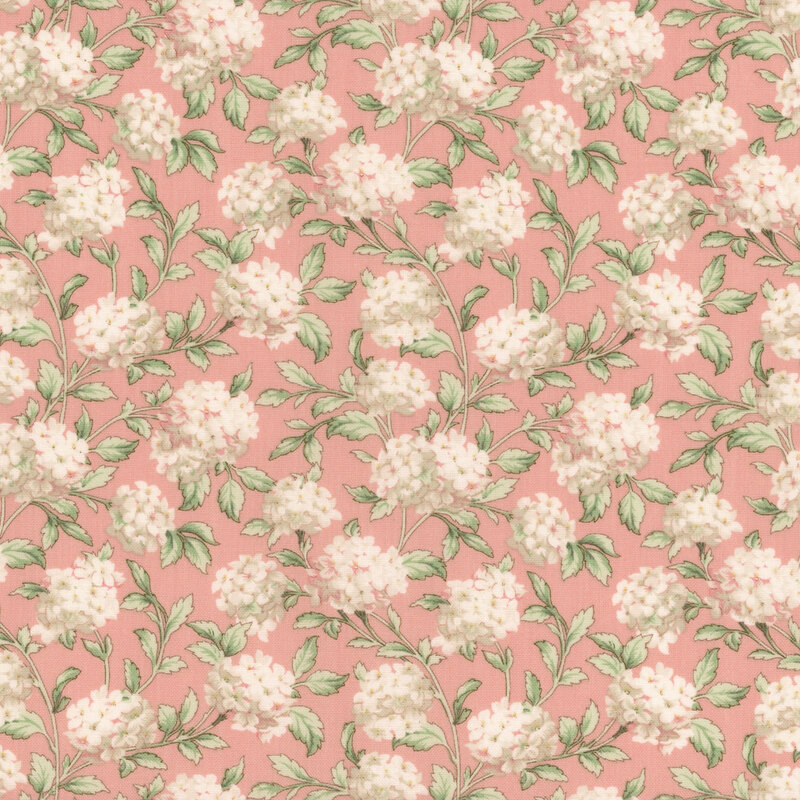 A swatch of pink fabric with scattered bunches of pinkish white hydrangea flowers.