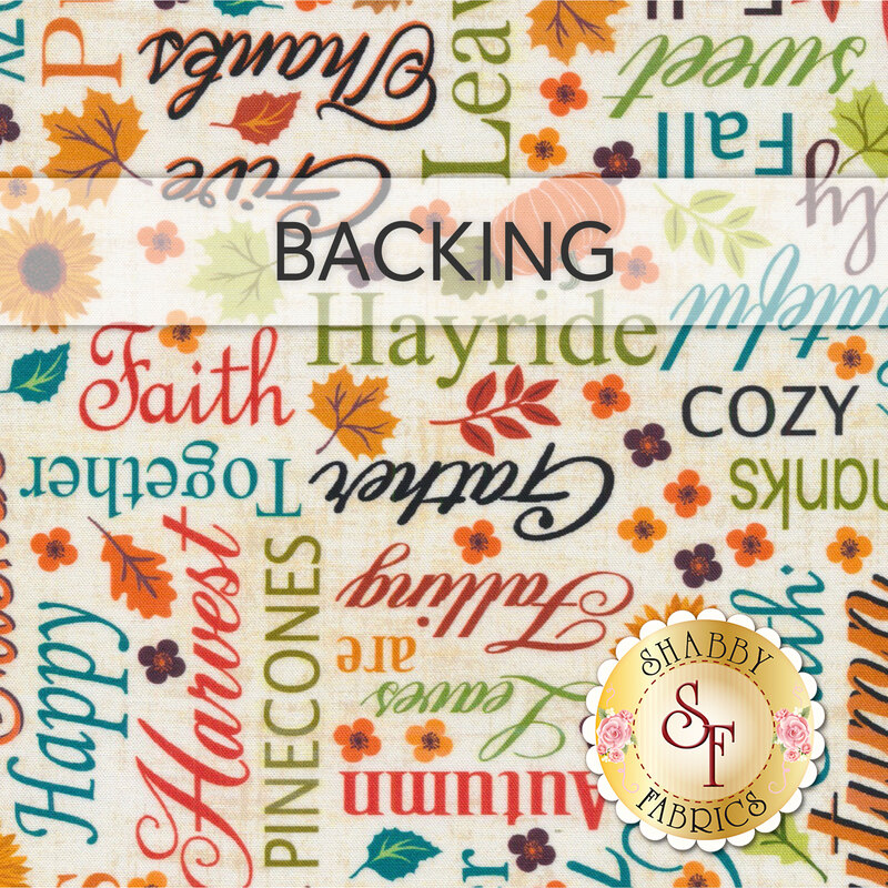 A swatch of cream fabric covered in perpendicular fall-and-autumn-themed words. A banner at the top reads 