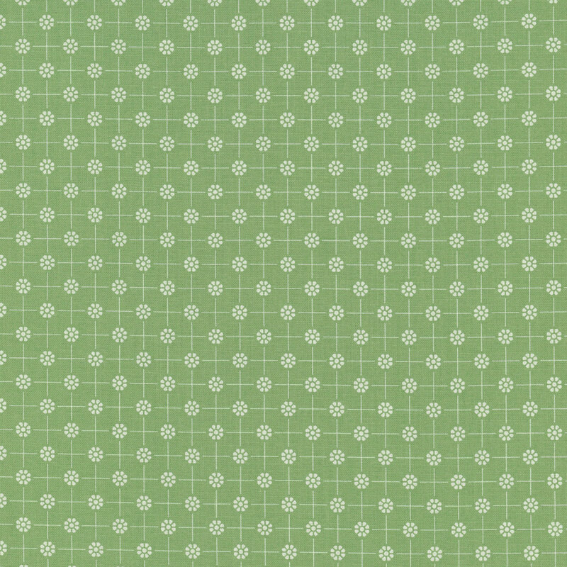 Green fabric with white dotted florals arranged in a polka dot pattern connected by thin lines