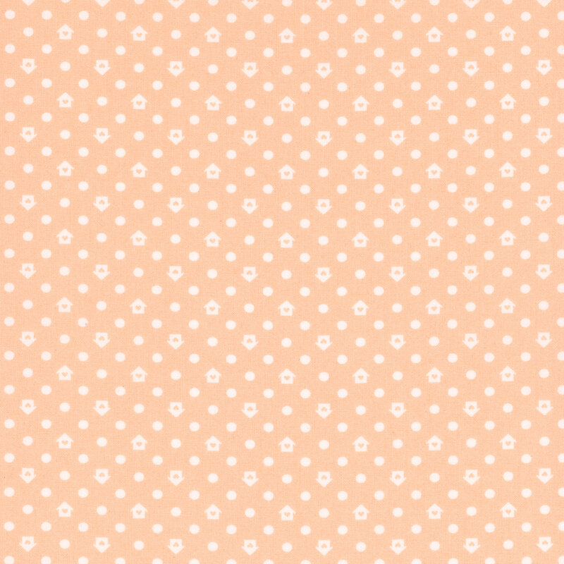 Peach fabric with a white house and dot pattern