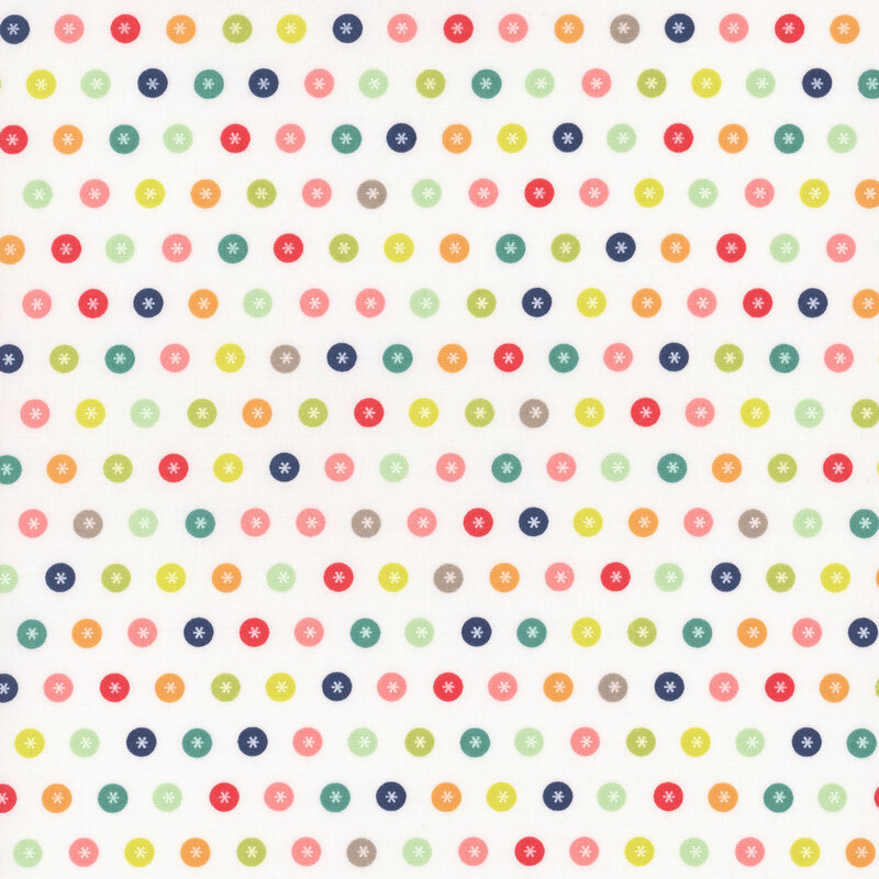 White fabric with neat rows of multicolored circles with white asterisks in the center.