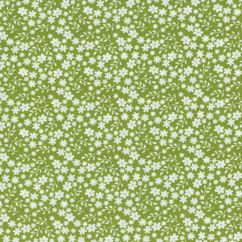 Green fabric with scattered solid white flowers and branching leaves.