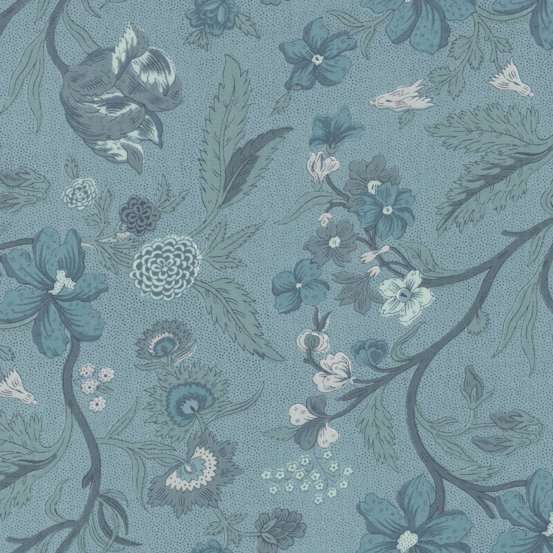 Blue fabric featuring sprawling vines with leaves and flowers