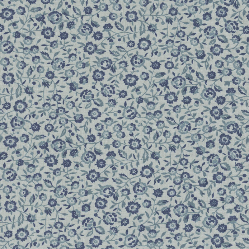 Blue tonal fabric featuring a packed design of vines and small florals