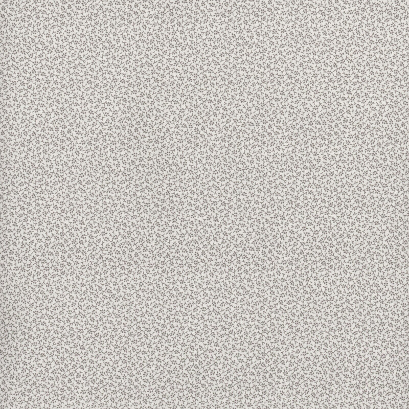 White fabric with a grey leaf pattern